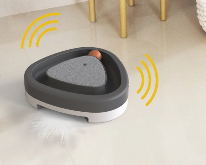 Close-up of rotating turntable component on triangle cat toy