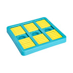 Dog puzzle toy with sliding compartments shown from side angle
