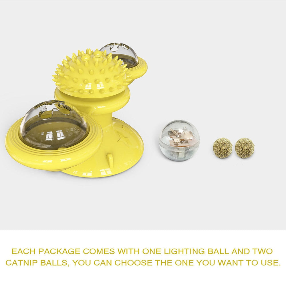 Yellow cat toy with a lighting ball and two catnip balls on a white background