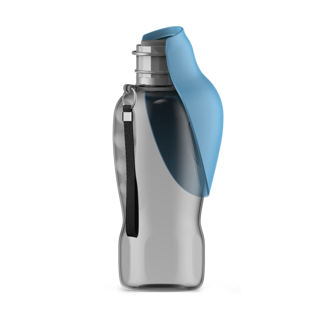 Dog water bottle with unfolded drinking bowl on flat surface
