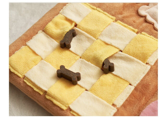Checkered fabric mat with brown dog toys on a checkered background