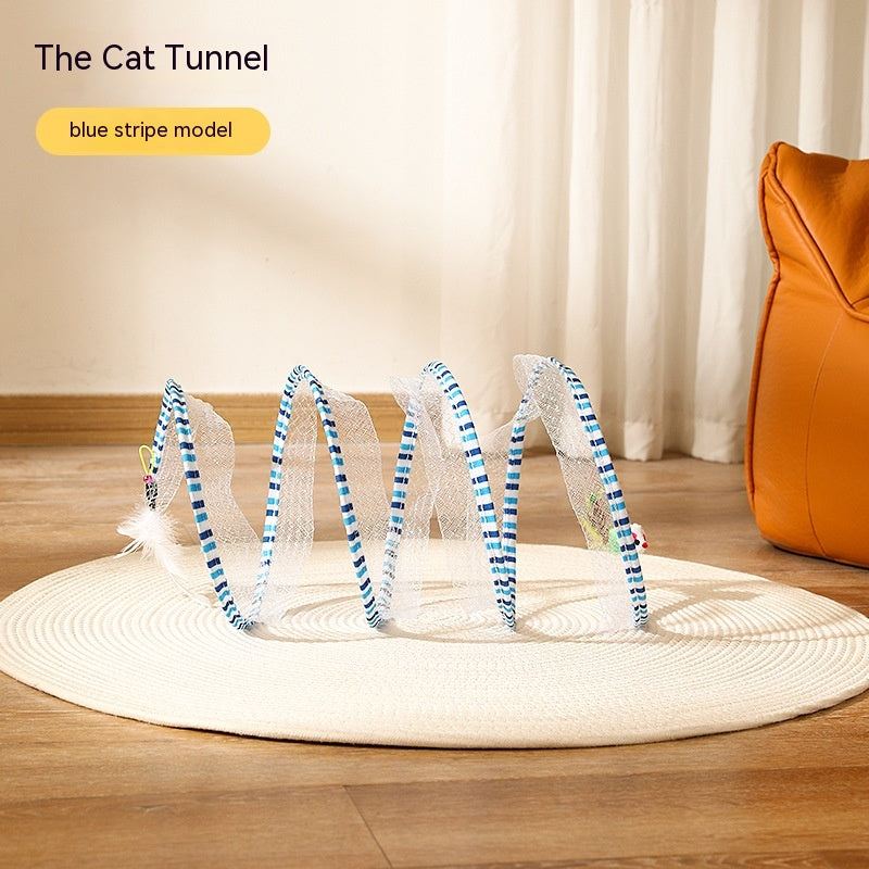 Folded cat tunnel toy photographed on indoor floor background