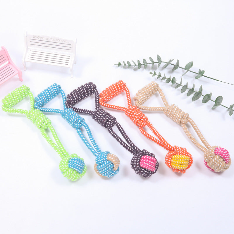Cotton Rope Ball Dog Toy in assorted colors with loop handles, ideal for interactive chewing and dental care for dogs and puppies.
