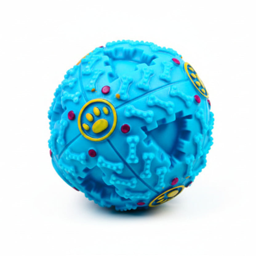 Dog treat dispenser toy photographed on flat surface