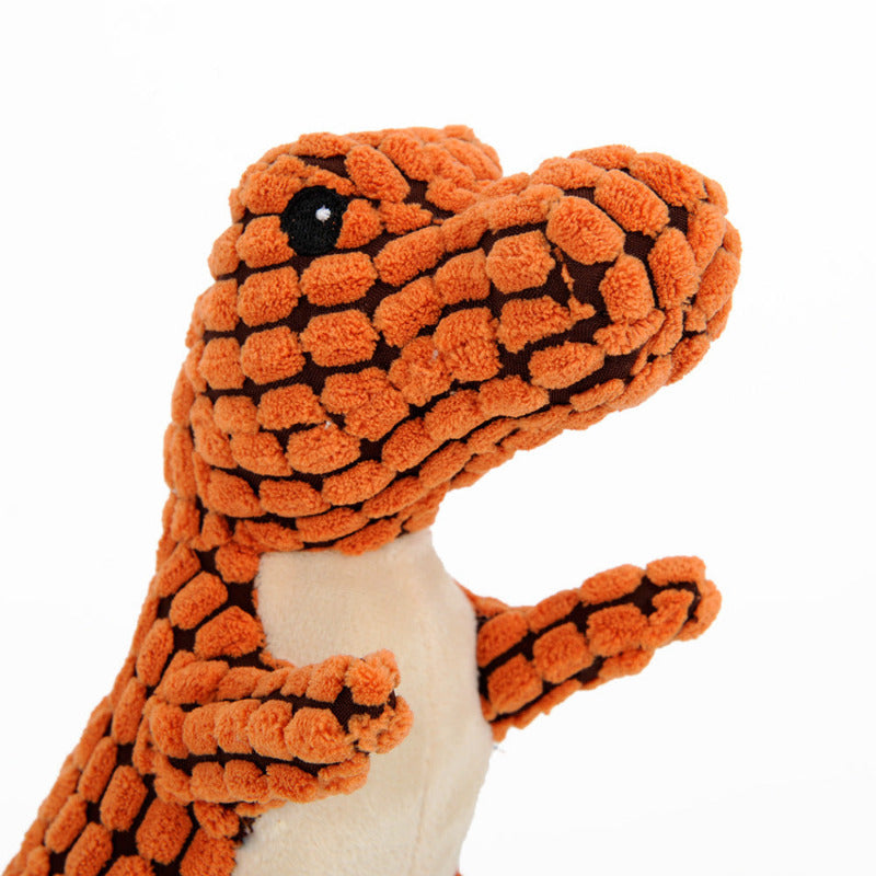 Plush toy resembling a snake with orange and black pattern on a white background