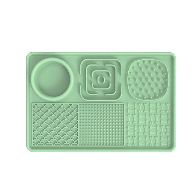 Mint green silicone mat with textured sections on a white background