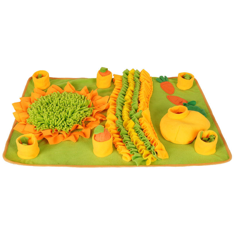 Colorful toy set resembling vegetables on a green base with a white background